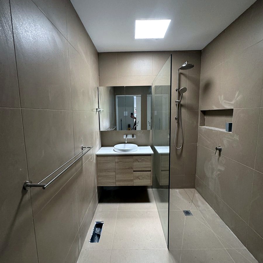 Accessible bathroom renovation with grab rails