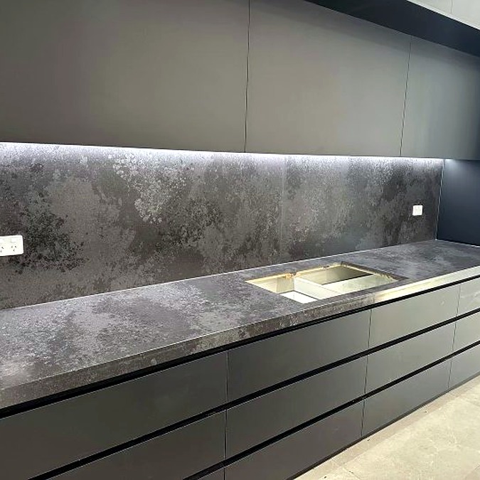 Kitchen renovation with dark stone benchtop