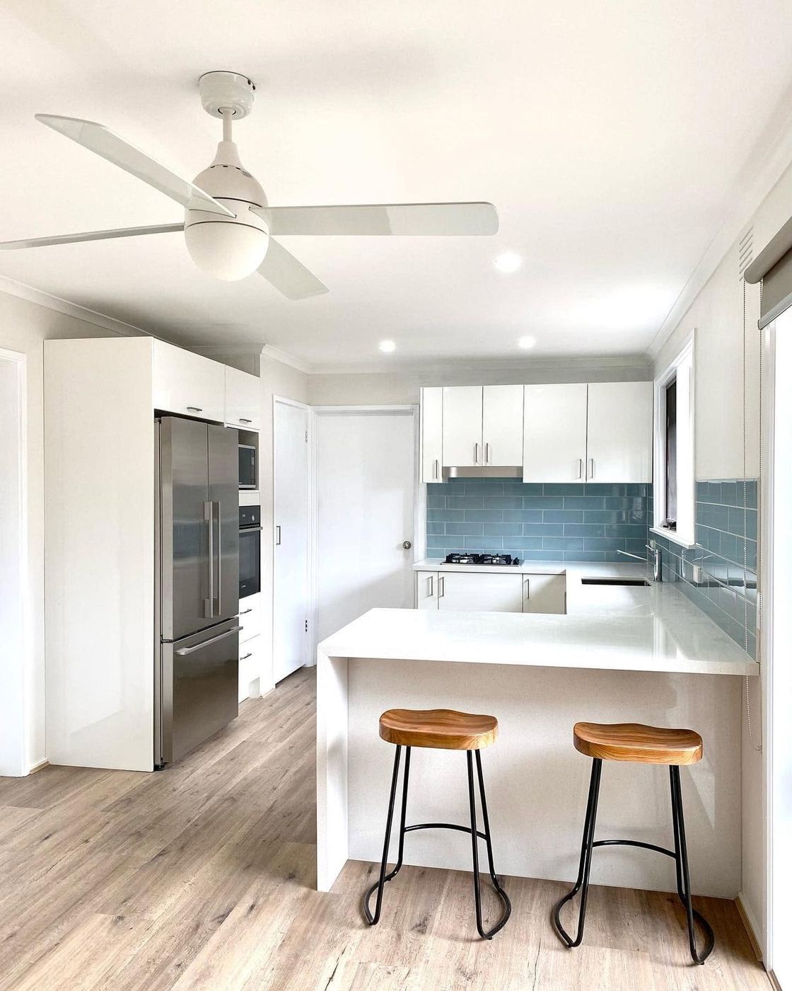 Kitchen renovation with island breakfast bar and timber stools