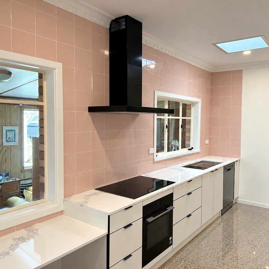 Kitchen renovation with pink splashback and terrazzo flooring
