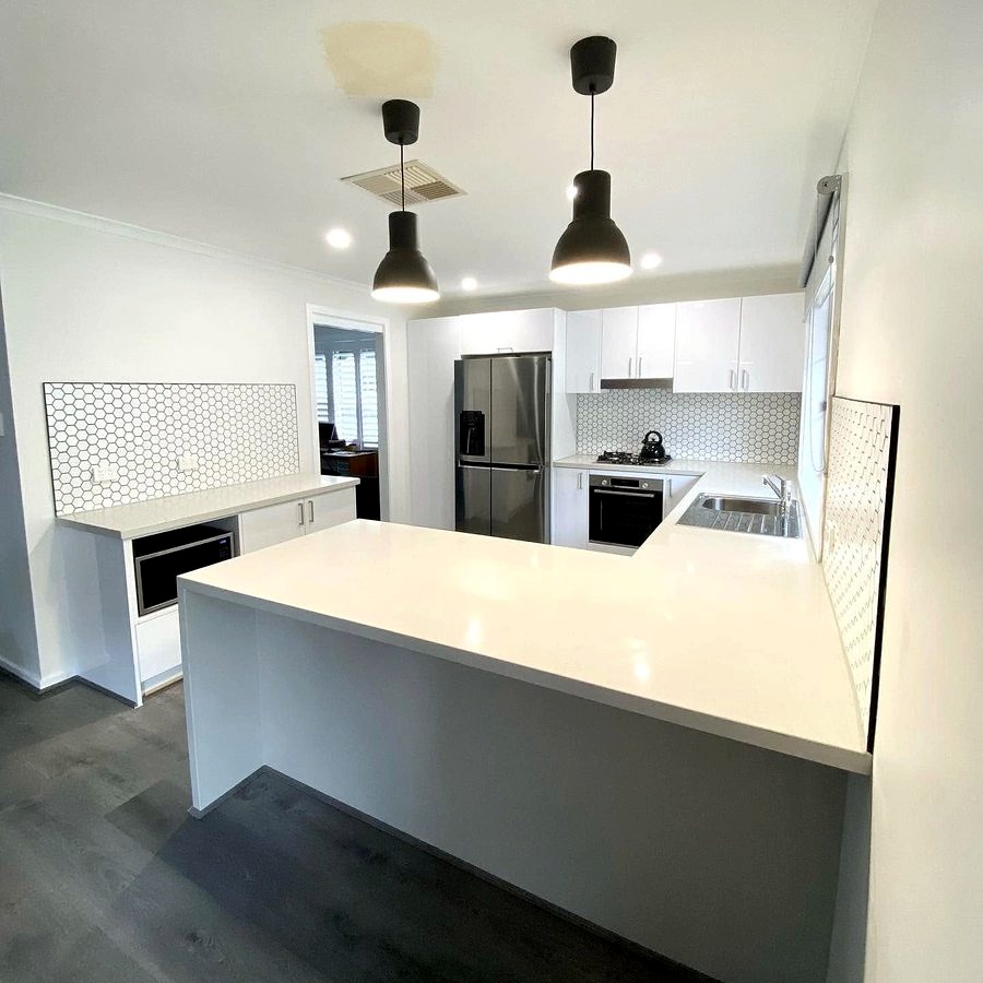 Laundry renovation with tiled splashback