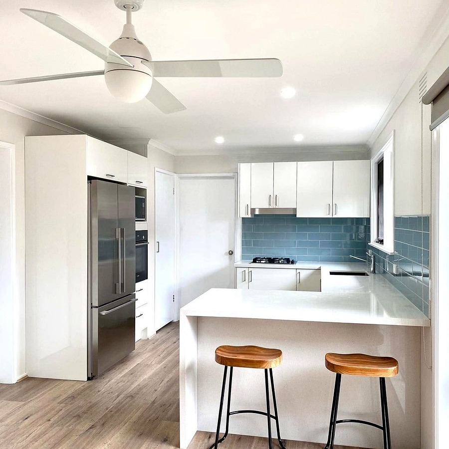 Open-plan kitchen renovation with timber flooring